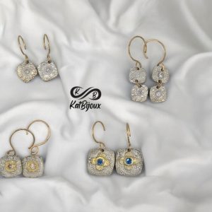 Silver earrings with stones and with gold ear hooks