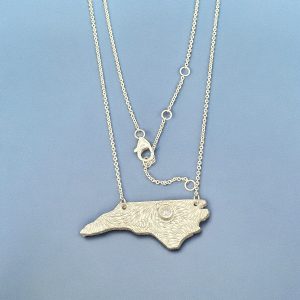 necklace-silver-north-carolina-raleigh Necklace of the state of North Carolina with a stone where RDU is.